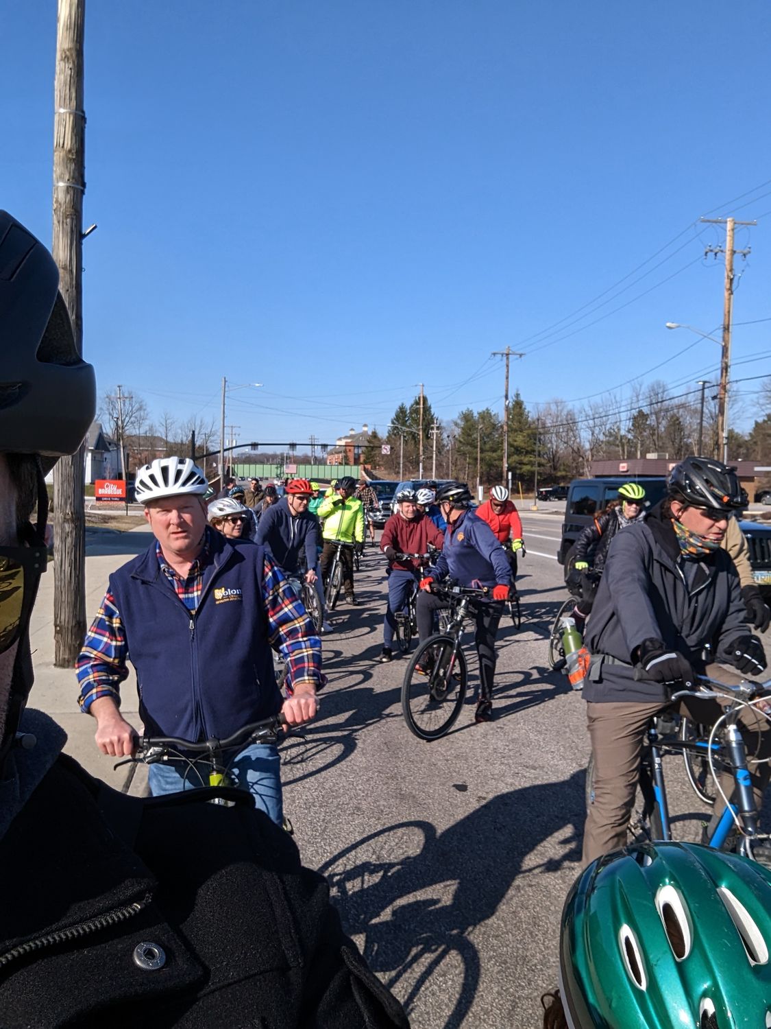 A group of Bike Solon riders gathered on the road at an early-spring slow roll